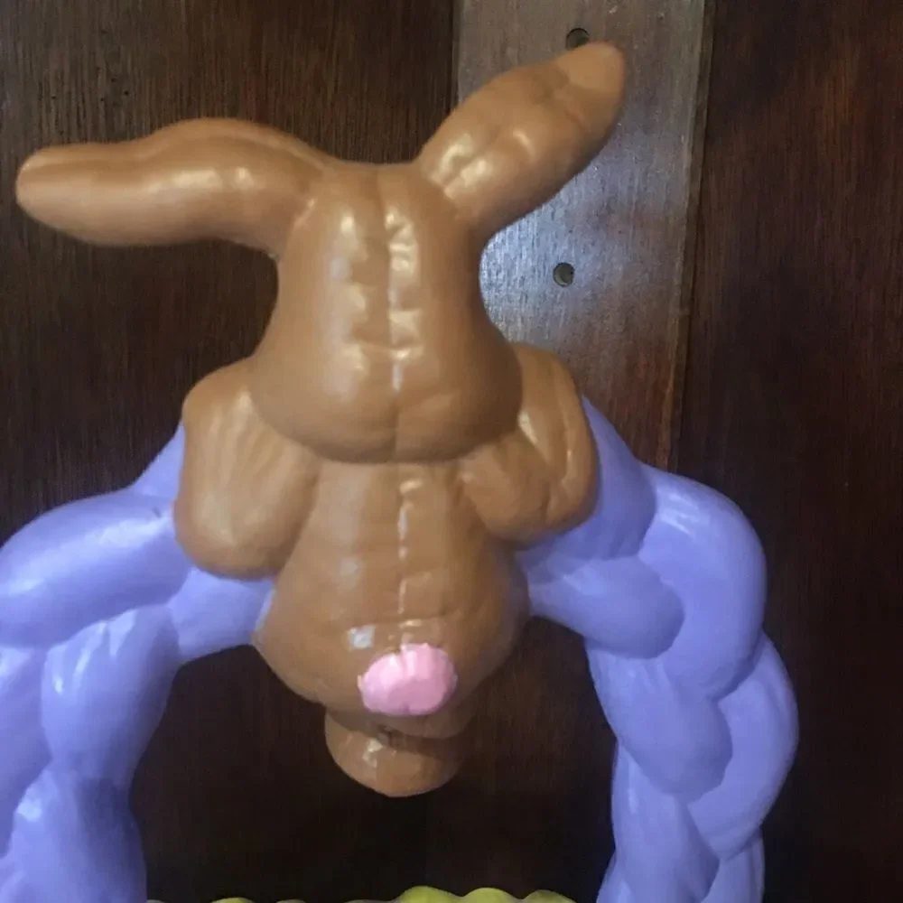 Ceramic Easter bunny hanging from basket